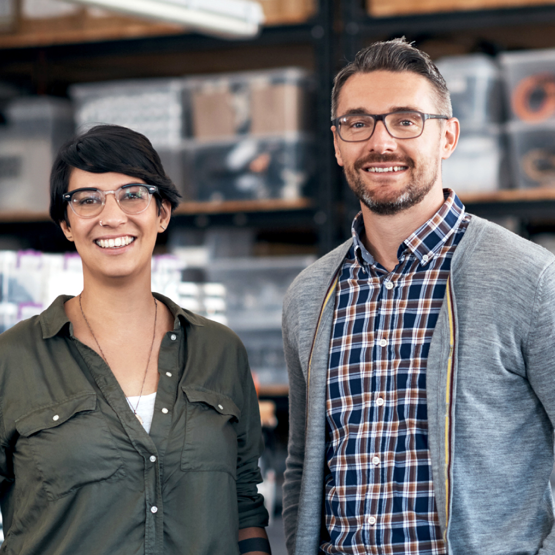 man-woman-business-owners-warehouse